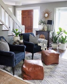 a living room filled with furniture and lots of pillows on top of it's floor