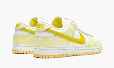 The Women’s Nike Dunk Low “Yellow Strike” is a women’s-only colorway of the retro basketball shoe that was released in August 2021.  Similar to the shoe’s “Purple Pulse” style, the “Yellow Strike” displays white leather on the perforated toe and mid-panel with contrasting blotted patterning on the overlaid panels, in this case, yellow instead of purple.  A yellow suede Swoosh appears on either side and yellow “Nike” branding is stitched onto the back of the shoe.  Moreover, yellow “Nike” with a Nike Dunk Low Yellow, Womens Dunk Low, Retro Basketball Shoes, Yellow Nikes, Yeezy 500, Nike Brand, Air Jordan 3, Nike Womens, Woven Labels