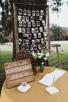 a wooden sign sitting on top of a table