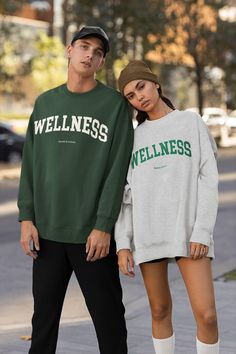 This super cool vintage style Wellness sweatshirt for athleisure lovers. Order a size up if you like oversized look. ------------------------------------------------------------------------------------------------------------------------------------------------- * 50% cotton, 50% polyester * Pre-shrunk * Classic fit with no center crease * 1x1 athletic rib knit collar with spandex * Air-jet spun yarn with a soft feel and reduced pilling ----------------------------------------------------------- Urban Crew Neck Tops For Leisure, Green Crew Neck T-shirt For Leisure, Green Crew Neck T-shirt, Oversized Crew Neck Sweatshirt For Sports, Athleisure Slogan Sweatshirt For Streetwear, Graphic Print Sweater For Streetwear And Sports Season, Fall Crew Neck Activewear For Streetwear, Graphic Print Sweater For Streetwear, Relaxed Fit Letter Print Athleisure Sweater