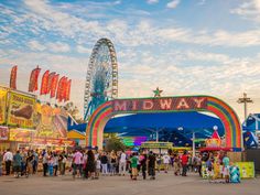 an amusement park filled with lots of people