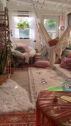 a living room filled with lots of furniture and decor on top of carpeted flooring