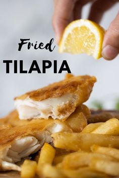 a hand squeezing lemon on top of a fried tilapia. Fried Tilapia Recipes, Cilantro Garlic Sauce, Fried Tilapia, Tilapia Recipe, Tilapia Recipes, Quick Meal, Creamy Mashed Potatoes, Inspired Recipes, Fried Fish