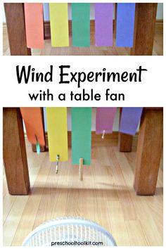 a table with colorful paper on it and the words, wind experiment with a table fan