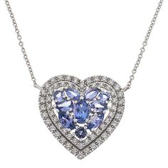 Colleen Lopez Tanzanite & Zircon Double Halo Sterling Silver Necklace An elegant addition to any outfit, this tanzanite necklace features a double halo of sparkling white zircon. Choose from a heart, oval, or emerald-cut shape to make it your own.       Approx. 18"L with 2" extender     Heart drop approx. 7/8"L x 15/16"W     Oval drop approx. 7/8"L x 3/4"W     Emerald cut drop approx. 13/16"L x 11/16"W     Stamped .925 sterling silver     Rhodium plating     Cable chain with lobster-claw clasp Tanzanite Necklace, Color Bands, Double Halo, Silver Heart Necklace, Sterling Silver Necklace, Emerald Cut, Cable Chain, A Heart, Lobster Claw