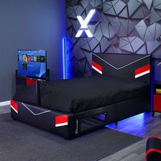 a bed room with a neatly made bed and a flat screen tv on the wall