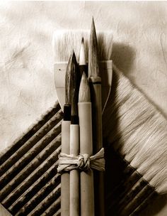 an assortment of brushes sitting on top of each other