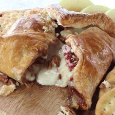 an apple pie is cut in half on a cutting board