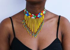 African beaded necklaces, African beaded jewelry, Beaded women jewelry, Christmas gift for her, Moms gift, Fringe necklace, Gift for her An elegant necklace that can match any outfit. Handmade by the Maasai women in Kenya using fine beads. Color: Yellow Available in different colors.  Neck size: 14 inches 3-5 days delivery via DHL Express.  Pay shipping fee for the first item only and additional items ship for free. To view more items in our shop, kindly click here:  nkoroicrafts.etsy.com Traditional Beaded Fringe Necklace As Gift, Adjustable Beaded Fringe Necklace, Beaded Fringe Necklace With Round Beads As Gift, Gift Necklace With Beaded Fringe And Round Beads, Beaded Fringe Necklaces With Round Beads As Gifts, Multicolor Beaded Fringe Necklaces As Gift, Multicolor Beaded Fringe Necklace Gift, Multicolor Beaded Fringe Necklace For Gift, Adjustable Beaded Necklaces With Beaded Fringe As Gift