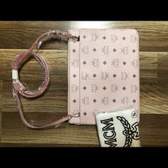 New Mcm Bag. Can Be Worn As A Clutch, Pouch, Or Crossbody. Pink With Gray Mcm Monogram. Great Color For Summer! Comes With Duster Bag. Pink Luxury Mobile Phone Bag, Designer Pink Shoulder Bag With Mobile Phone Pocket, Designer Pink Pouch Shoulder Bag, Pink Designer Pouch Shoulder Bag, Luxury Pink Pouch For Everyday Use, Pink Mobile Phone Pouch, Designer Pink Travel Pouch, Designer Pink Pouch For Everyday Use, Pink Mobile Phone Clutch Bag