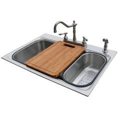 a kitchen sink with a cutting board on the bottom and two faucets above it