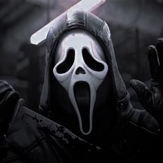 a person wearing a mask and holding a knife