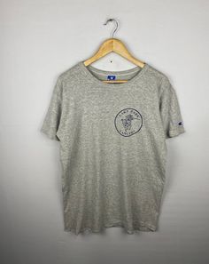 ITEM: Vintage 90s  Champion Lake Park Lancers Tshirt Large Champion  Usa Sportswear Champion  Tees Tshirt Size L  *ITEM DETAILS: 👇🏻 Please be aware that all vintage items will usually show a few signs of wear or fading due to age, but anything visible such as stains or holes, and serious flaws have been photographed.For any further information on this item please contact us and we will be happy to help. *SIZE: LARGE  * ACTUAL SIZE MEASUREMENT: 👇🏻 *PIT TO PIT(WIDTH):22"INCHES *LENGTH(FROM SHOULDER): 29"INCHES    *ALL MEASUREMENTS ARE TAKEN WITH THE GARMENT FLAT ON THE GROUND *VIEW FULL SHOP HERE: *SHIPPING: (WITH ONLINE TRACKING NUMBER ) *DHL EXPRESS SHIPPING:4-6 BUSINESS DAYS *Don't Worry About Customs Tax or Fees. I usually Declare As 'Gifts' And Low Value  *PAYMENT (ACCEPT "PAYPAL" O 90s Style Short Sleeve Sports T-shirt, Grey Logo Print Crew Neck T-shirt, Athletic Heather T-shirt With Logo Crew Neck, Athletic Heather Crew Neck T-shirt With Logo, Sports Crew Neck T-shirt, Athletic Heather Graphic Tee For Streetwear, Sporty Crew Neck Top With Front Print, Sports Crew Neck Top With Front Print, 90s Style Crew Neck T-shirt With Front Print