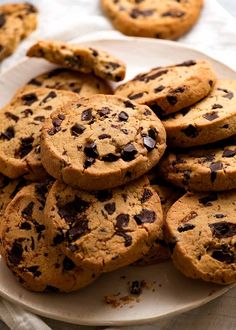 a plate full of chocolate chip cookies on a table