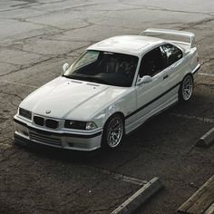 a white car parked in a parking lot