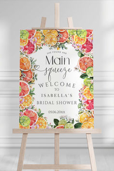 an easel with a sign that says main squeeze welcome to the bride and groom