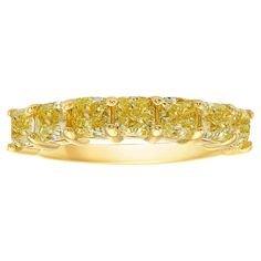 Signature half eternity band style, giving you the look of a full eternity band while using half the amount of diamonds. 3.45 Carat Total Weight 5 Radiant cut diamonds Fancy Yellow Color VS-VVS Clarity Diamond Set in 18k Yellow Gold Handmade in NYC This piece can be viewed before purchase in our showroom in NYC, or at one of our retail partners throughout the country, please inquire for more info. Appraisals can be done on all purchases. We use the best jewelers in New York and can redesign any piece to your liking, using our incredible Fancy Colored Diamonds. Rare Colors was founded after decades of experience in fancy colored diamond trading. It publicly opened the direct door of colored diamonds to jewelry lovers and collectors such as yourself, at best market values. We are one of the Memory Ring, Eternity Diamond Band, Rare Colors, Diamond Half Eternity Band, Fancy Yellow Diamond, Diamond Eternity Band, Bracelet Love, Half And Half, Radiant Cut Diamond