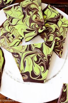 chocolate and green swirled cookies on a white plate