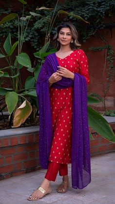 Bring on the festive spirit with our kurta set in hand embroidered chanderi silk. Fully lined kurta and pants. Made in chanderi silk. Dupatta in mul cotton with gold tikki details. Color of Kurta + Pants : Red. Color of Dupatta : Purple. Model height is 5.6” and is wearing a size S. Wash Care : Dry Clean Only. Festive Semi-stitched Straight Kurta Salwar Kameez, Festive Cotton Silk Palazzo Set With Dupatta, Unstitched Straight Kurta With Dabka Work For Festive, Festive Unstitched Suit With Dabka Work And Straight Kurta, Festive Chanderi Sets With Resham Embroidery, Eid Straight Kurta Set With Gota Work, Eid Gota Work Straight Kurta Set, Cotton Silk Palazzo Set With Resham Embroidery For Festivals, Chanderi Palazzo Set With Resham Embroidery For Diwali