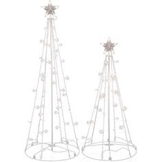 two metal christmas trees with white balls and stars on each one stand in front of a white background