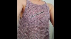 a woman wearing a tank top made out of yarn