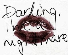 the words are written in black ink on a white background with a red lipstick imprint