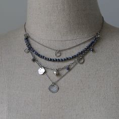 "The Raw Silver and Sapphire Layered Necklace for Women is a stunning piece of handcrafted jewelry. Made with sterling silver and featuring blue sapphire gemstones, this necklace showcases the natural beauty of these materials. The beaded necklace is oxidized and polished, adding depth and charm to the overall design. Its boho style gives it a trendy and fashionable appeal. Layered necklace for women is perfect jewelry gift for sister or wife. Dress up your necklace on special occasion, or send Cheap Silver Layered Jewelry, Cheap Bohemian Silver Layered Necklace, Cheap Silver Layered Beaded Necklace, Cheap Silver Beaded Chain Layered Necklace, Affordable Silver Layered Jewelry, Boho Choker Necklace Silver, Boho Jewelry Silver, Elegant Silver Beaded Lapis Lazuli Necklace, Sterling Silver Beaded Multi-strand Jewelry