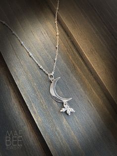 "Love this Sterling Silver Crescent Moon with it's bead bundle (stars anyone?) at about 1\" in length! A gorgeous combination of 2D and 3D and a little movement come together in this sweet design. It makes beautiful necklace on a 16\" or 18\" sterling beaded chain. A simple celestial gift or for yourself. These are pretty alone or stacked with other necklaces. Comes wrapped in a recycled-paper and velvet-ribboned gift box, per your request with no extra charge! - See options to the right. FREE d Moon Shaped Sterling Silver Jewelry For Mother's Day, Moon Shaped Jewelry With Star Charm For Gifts, Sterling Silver Moon Charm Jewelry For Mother's Day, Sterling Silver Moon Charm Necklace For Gift, Sterling Silver Jewelry With Moon Charm For Mother's Day, Mother's Day Sterling Silver Moon Charm Jewelry, Mother's Day Sterling Silver Jewelry With Moon Charm, Dainty Moon Charm Necklace For Wedding, Silver Celestial Jewelry For Mother's Day