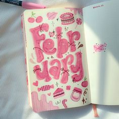 an open notebook with pink writing on it