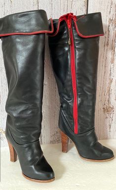 Size - 6.5M Material - leather upper, balance man made  Label - Zodiac  These black and red leather knee high cuff boots feature an inside zipper and high heels. They have minimal wear and are in excellent vintage condition.  Measurements  Heel - 4 inches  Height - 14 inches (measured from top of heel) Width - 3 inches (measured at widest part of sole) Cuff Boots, Crop Denim Vest, How To Make Labels, Leather Boots Heels, Boot Cuffs, Vintage Boots, Cropped Denim, Boot Shoes Women, Red Leather