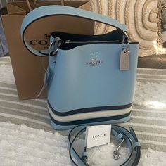 Gorgeous Coach Bucket Bag New/Comes With Strap No Longer Made!! Accepting Offers Designer Blue Rectangular Bucket Bag, Luxury Blue Shoulder Bucket Bag, Luxury Blue Bucket Bag For Shopping, Blue Evening Bag With Silver-tone Hardware, Luxury Blue Bucket Bag, Evening Blue Bags With Silver-tone Hardware, Blue Evening Bags With Silver-tone Hardware, Blue Bucket Bag With Detachable Handle For Evening, Blue Top Handle Bucket Bag For Evening