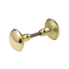 an antique brass door handle on a white background