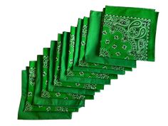 six green napkins with paisley designs on them