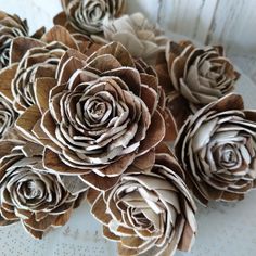 some paper flowers are sitting on a table