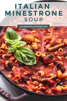 italian minestrone soup in a skillet with basil leaves on top and text overlay