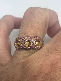 Unusual cut of citrine surrounded by pink tourmaline Sterling Filigree gold finished Setting Handmade Size 5.5 Can be resized, my jeweler charges a $10 fee All rings are shipped in a nice gift box. Check out our over a THOUSAND great reviews Engraving is $4 per letter and is not always perfect depending on the piece. It can take a few days if the jeweler is busy. This is payable to Paypal Judithsltd@gmail.com Citrine Wedding Ring, Citrine Ring Engagement, Gothic Ring, Gothic Rings, Jewelry Accessories Ideas, Vintage Heart, Heart Locket, Pink Tourmaline, Rings Statement