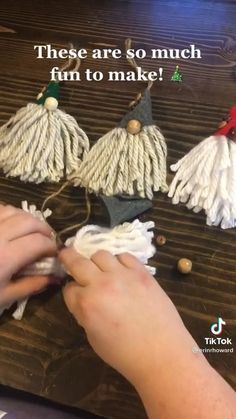 someone is making some tassels out of yarn on a wooden table with the words, these are so much fun to make