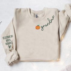 Custom Grandma Embroidered Sweatshirt Grandma Pumpkin And Kids Names All hoodies and crewneck sweatshirts are fleece. 65% cotton 35% poly Care instructions: Machine cold wash, inside out, with like colors. Only non-chlorine bleach. Tumble dry low. Medium iron. Do not iron decoration. Double-needle stitched neckline, bottom hem and sleeves t-shirt. Unisex sizing. Size chart is available in the listing photos. All measurements are approximate. Measurements may vary about 2″ less or more. Hooded Fall Sweatshirt With Letter Embroidery, Fall Hooded Sweatshirt With Letter Embroidery, Fleece Top With Letter Embroidery And Long Sleeves, Hooded Sweatshirt With Letter Embroidery For Fall, Long Sleeve Fleece Top With Letter Embroidery, Long Sleeve French Terry Sweatshirt With Embroidered Logo, Fall Cotton Fleece Long Sleeve Hoodie, Cotton Sweater With Embroidered Logo, Fall Fleece Tops With Letter Embroidery