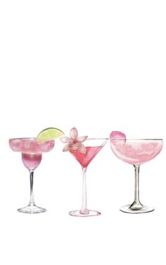 three different colored cocktails in coupe glasses with one lime and the other pink, on a white background