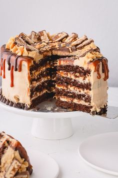 a chocolate cake with caramel drizzled on top and one slice cut out