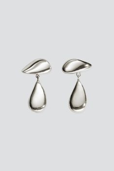 Sterling Silver Vera Earrings from Agmes. Sterling silver post. - Sterling silver - Handmade in USA - Drop: 2.5" Contemporary Silver Drop Jewelry, Contemporary Silver Drop Earrings, Modern Silver Drop Earring Set, Modern Silver Drop Earrings With Polished Finish, Contemporary Teardrop Silver Jewelry, Modern Silver Drop With Polished Finish, Silver Drop Jewelry With Shiny Finish, Silver Drop Earrings For Formal Occasions, Modern Silver Drop Jewelry