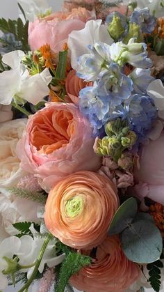 a bunch of flowers that are sitting on a table