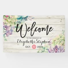 wedding welcome sign with flowers painted on the wood planks and text that reads, welcome to the wedding of elizabeth & stephen oct 22