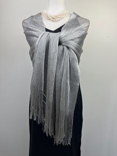 This versatile shimmery shiny shawl with fringe can be used to dress up an outfit for a special evening, a wedding or as a neck scarf in spring. Effortlessly give a dress a new look by simply adding this shawl. Perfect as bridesmaid gifts or wedding favours, the perfect gift for any occasion. This is not a very large shawl. There is metallic thread woven in the shawl that gives shining shimmery look.  Measures 20"Wx 75" The colours are very close however not exact. I tried to to capture the colo Elegant Fringe Shawl Scarf, Elegant Fringed Shawl Scarf, Fringed Shawl For Party, Evening Shawl Wrap Scarf, Glamorous Party Shawl, Evening Shawl Wrap, Elegant Shawl For Summer Parties, Festive Shawl Scarf For Party, Festive Party Shawl Scarf