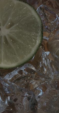 a lime slice sitting on top of ice