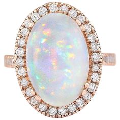 7.92 Carat Natural Opal 14 Karat Rose Gold Diamond Ring Stamped: 14K Rose Gold Total Ring Weight: 9.0 Grams Total Natural Opal Weight is 7.17 Carat (Measures: 16.00x12.00 mm) Color: Multicolor Total Natural Diamond Weight is 0.75 Carat Color: F-G, Clarity: VS2-SI1 Face Measures: 21.20x15.95 mm Sku: [704164W] Luxury Rose Gold Opal Ring, Formal Rose Gold Opal Ring With Diamond, Rose Gold Oval Diamond Ring Stamped 14k, Oval Rose Gold Diamond Ring Stamped 14k, Formal Rose Gold Opal Ring With Prong Setting, Opal Diamond Ring, Rose Gold Diamond Ring, Gold Diamond Ring, La Face