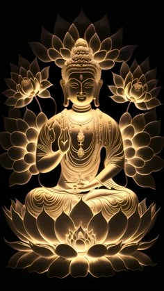 a buddha statue sitting in the middle of a lotus flower arrangement with lights shining on it