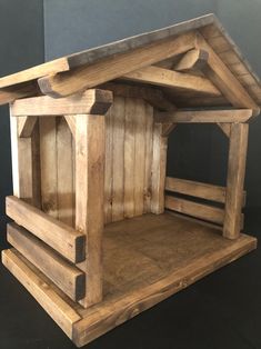 a wooden bird house made out of pallet wood