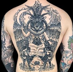 a man with tattoos on his back has an angel and demon tattoo on his back