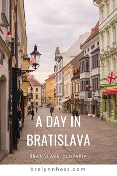 a street with people walking down it and the words a day in bratislava